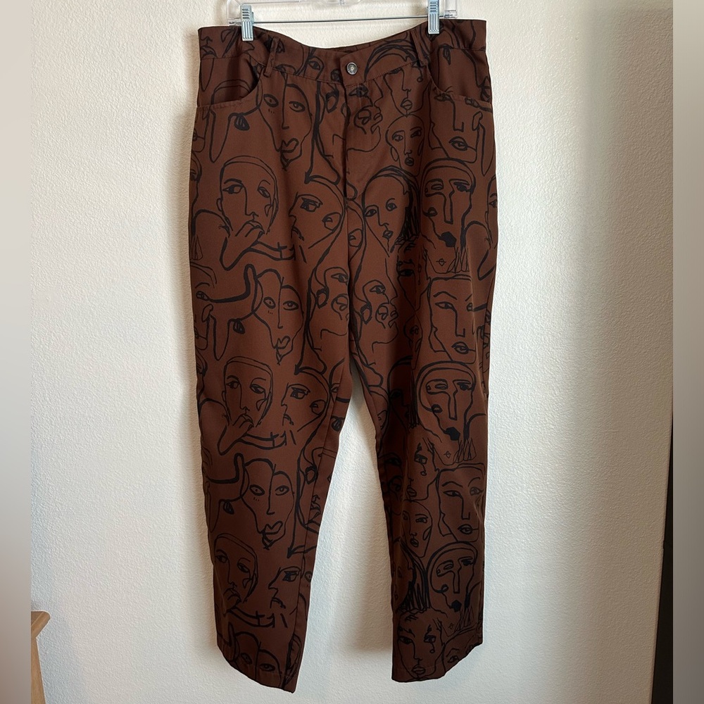 Brown pants with face drawings. Good condition, only worn a few times.